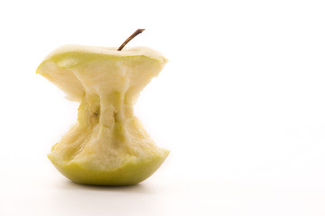 Bitten yellow apple on a white background.