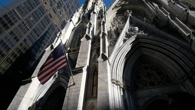 Close american flag fluttering  at Saint Patrick Church in New York