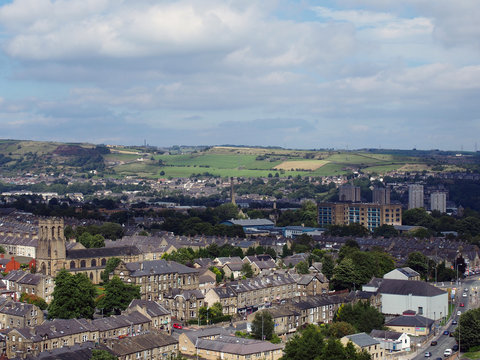 panoramic view of Halifax in west yorkshire with terraced streets buildings and surrounding countryside