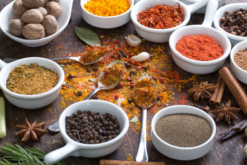 Herbs and spices in ceramic bowls.