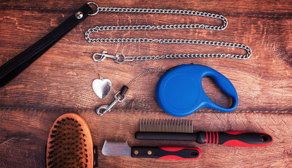 Pet accessories on wooden background. Top view. Pets and animals concept