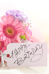 hand wriiten birthday card and Gerbera pastel color bouqet