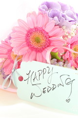 hand written happy wedding greeting card and flower bouquet