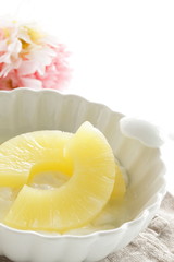 slides of pineapple on yogurt for healthy dessert image