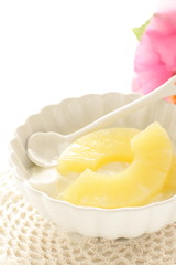 slides of pineapple on yogurt for healthy dessert image