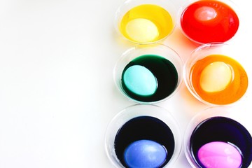 Eggs submerged in colored dye to make Easter eggs.