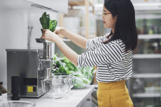Woman Belnding Vegetables at Kitchen
