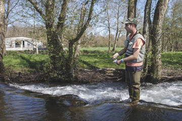 sport fisherman in river, Galicia, Spain.