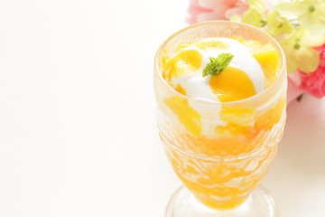 Homemade mango and vanilla ice cream in glass for gourmet dessert image