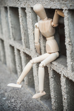 closeup of wooden character in outdoor - concept suicide