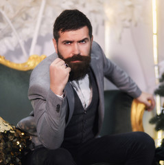 Lamber like male model with moustache and beard and showing dominant attitude with his body...