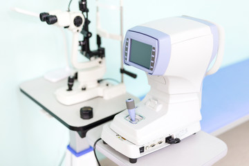 Modern ophthalmology clinic. Keratometer device measuring curvature of cornea. Prevention of astigmatism desease. 	High-tech solutions for eye care