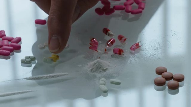 Prescription drug capsules opened on a tabletop