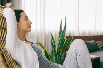Profile of Young Casually Dressed Caucasian Woman Relaxing With Eyes Closed