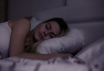 Woman sleeping at night.