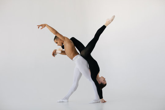 Man holding ballerina upside down