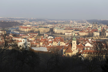 Fototapeta premium Sunny freezy winter Prague City with its Cathedrals, historical Buildings and Towers, Czech Republic