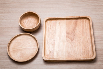 Wood dish on the wooden background.