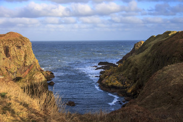 Beautiful landscape. Rocks, cliffs and the sea. Longhaven, Peterhead, Scotland, United Kingdom. February 2018