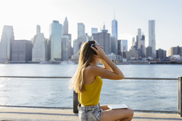 Young Beautiful WOman using a Digital Tablet in New York City Ou