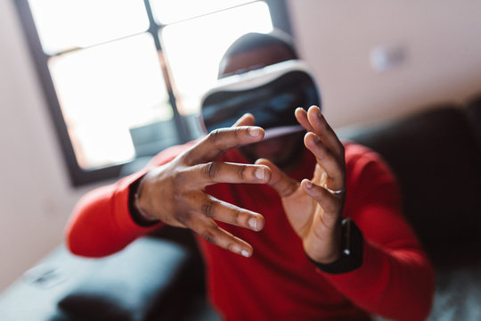 Man wearing VR glasses indoors