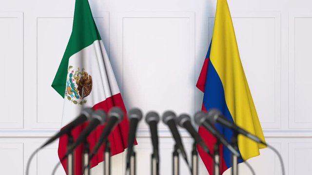 Flags of Mexico and Colombia at international meeting or negotiations press conference
