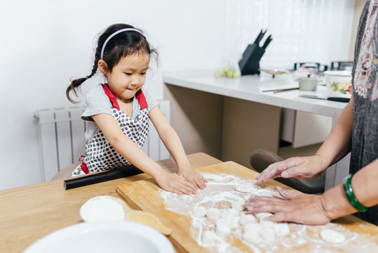 Family cooking in kitchen