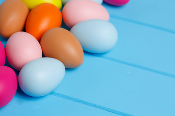 easter eggs on blue wooden background