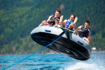Group of teenagers having fun with a speed boat during the Summer Break in British Columbia, Canada © nelu_goia