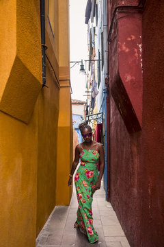 Woman visiting Burano, Venice, Italy.
