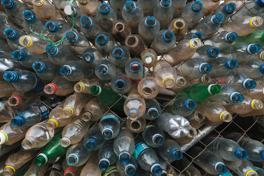 Bottles in fence