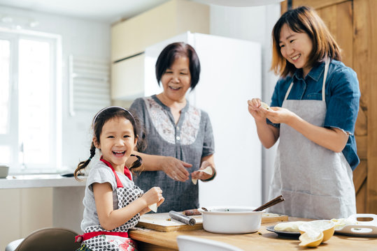 Family cooking in kitchen
