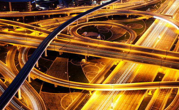 aerial view of busy traffic on sheikh zayed road intersection at night, Dubai - futuristic city