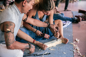 Woman at the wood carving workshop