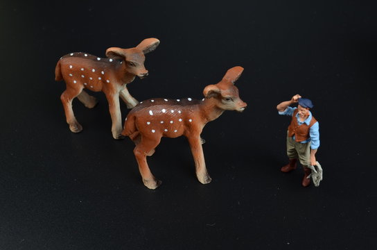 a plastic toy  with the man figure