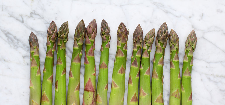Green asparagus on marble