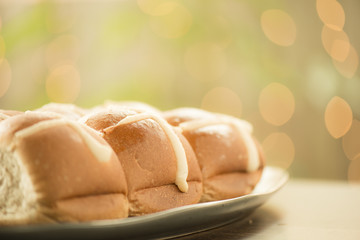 Tasty traditional Easter hot cross buns, closeup view.