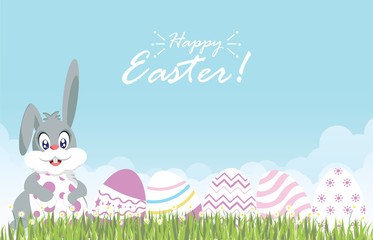 Easter eggs and easter bunny for decoration on fresh green grass and daisies flower.