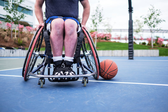 Active Disabled Athlete Practicing Wheelchair Basketball