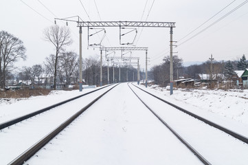 Winter and snow on the railroad tracks in winter