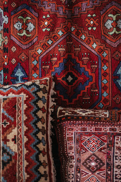 Handmade red rug and pillows  with pattern details