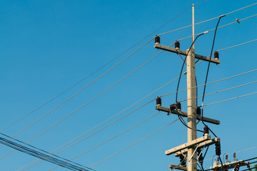 3 phases powerlines pose with blue sky background