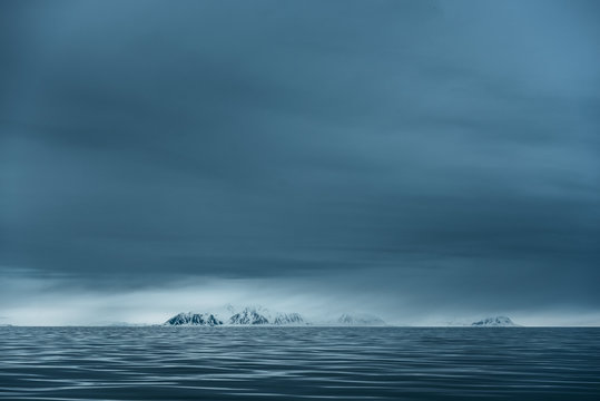 Scenic view of ocean against cloudy sky