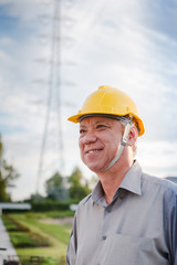 Engineer inspecting the high voltage power grid
