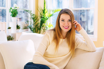 Young woman relaxing on a couch at home