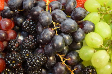 Collage Group of Berries and Concord and Niagara Grapes, Blueberries, Blackberries, Strawberries, Raspberries, Organic Healthy Juicy Fruit