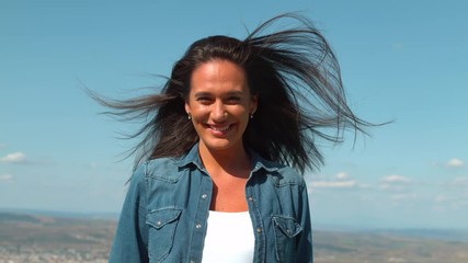 Wind blowing through a young woman's hair