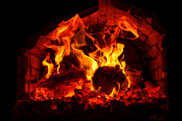 flames from burning wood in the fireplace. fire in the furnace close-up