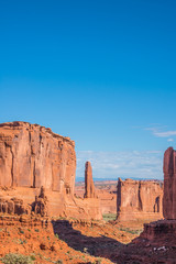 Red Rock Sandstone Formations in Canyon. Deep Blue Sky. Arches National Park, Utah. Vertical. Copy space.