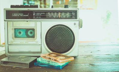Retro lifestyle - tape cassette with cassette player and recorder for listen music - vintage color tone effect.